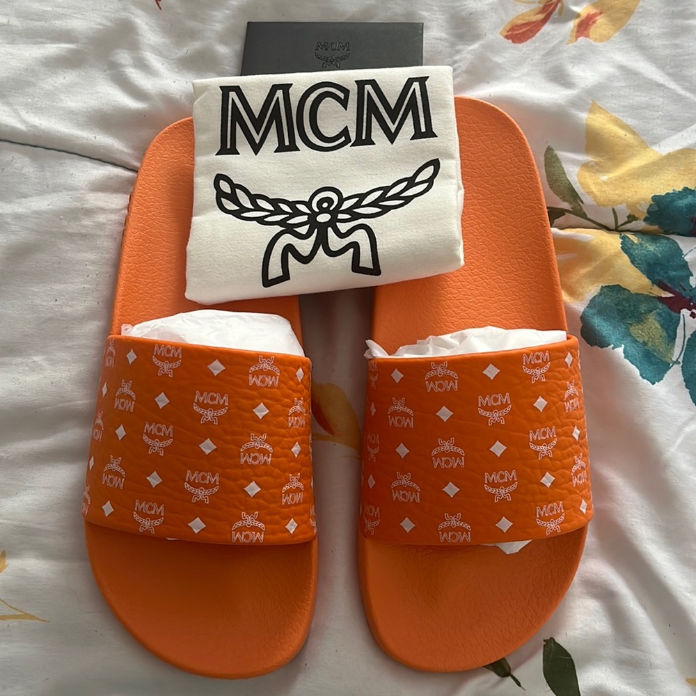 Orange mcm rubber slides